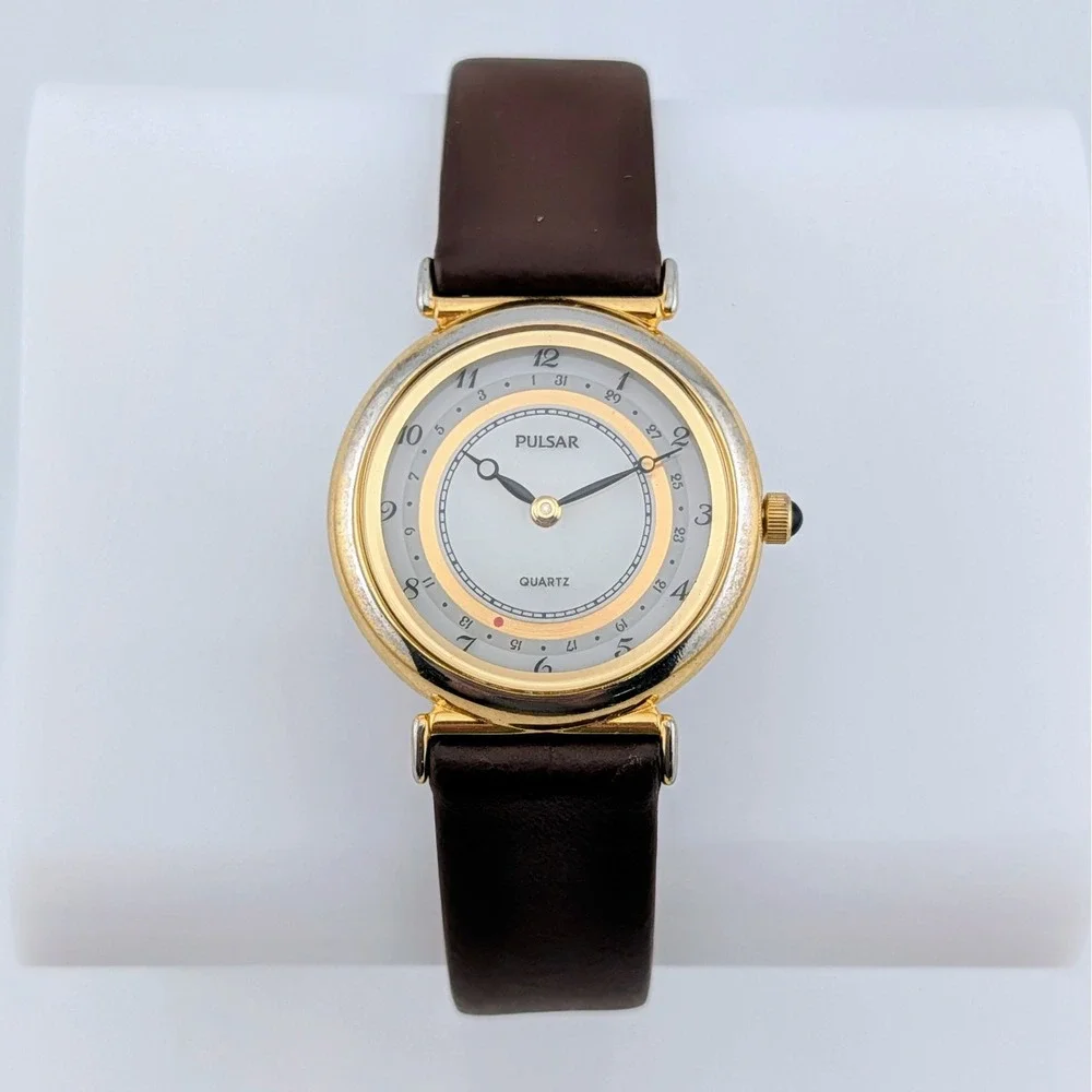 Pulsar V249-0030 Date Pointer Gold Tone White Dial Brown Leather Women's Watch